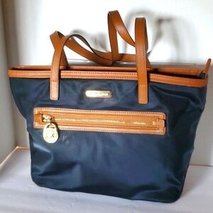 Micheal Kors Kempton Purse. Black/Brown Trim. Carried only a few times.